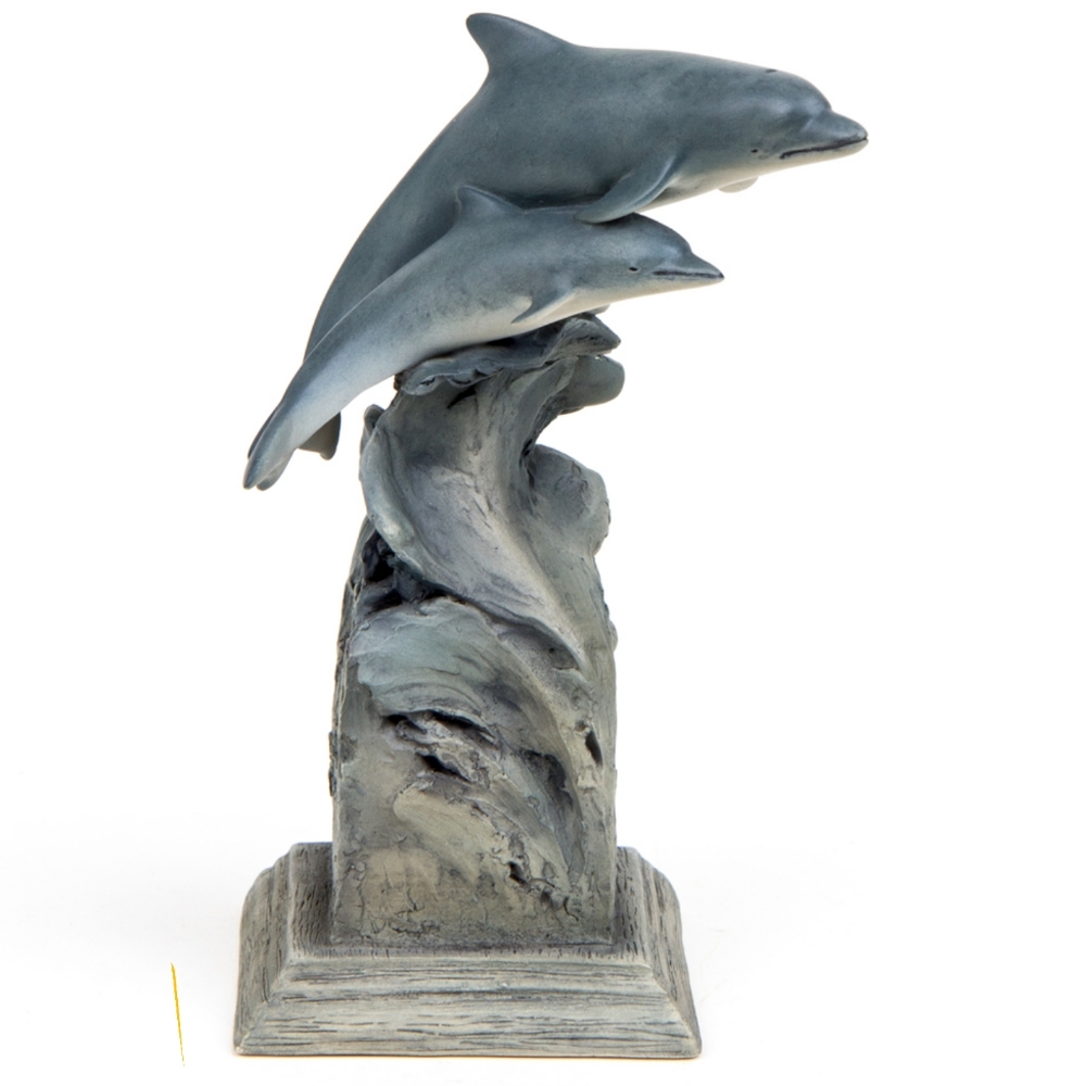 Dolphin sculpture dolphins riding a wave.